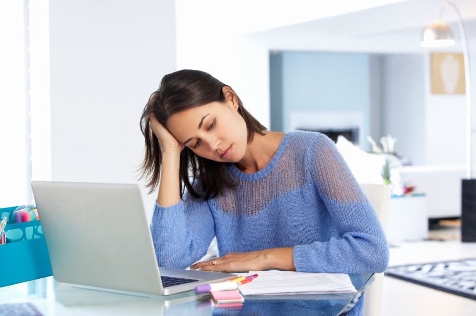 stressed woman looking at lost profits