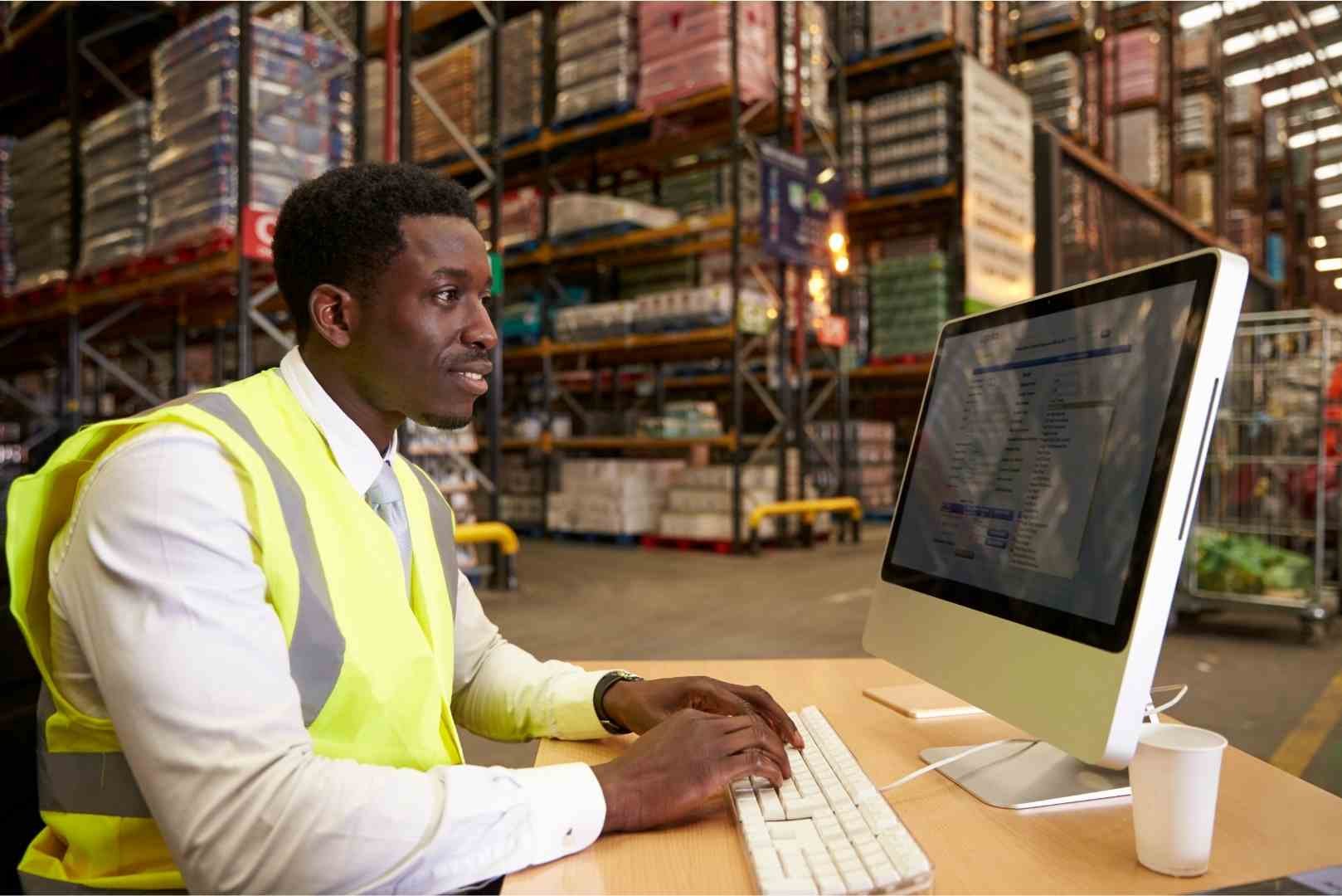 Warehouse manager looking at reports