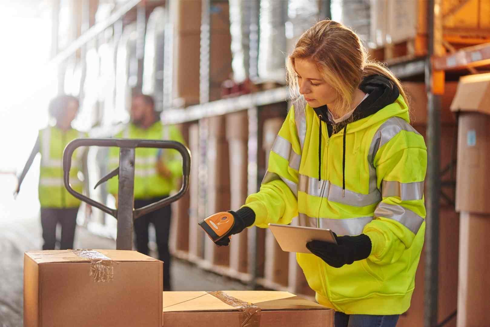 female warehouse worker using barcode scanner