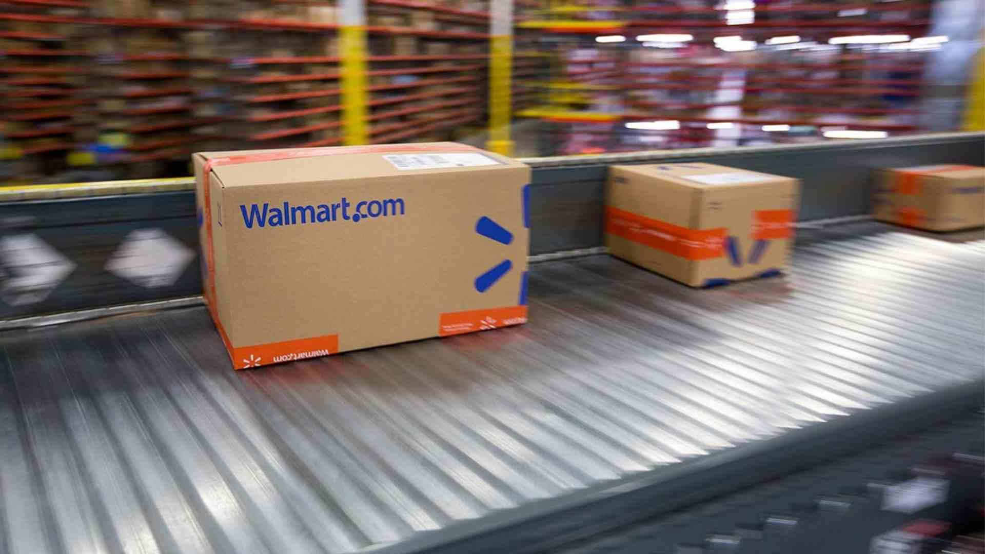 Walmart packages move along a conveyor belt inside a fulfillment center